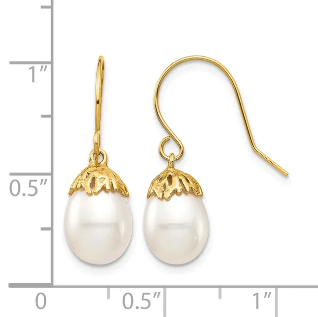 Pair of gold-toned drop earrings with white pearl teardrop pendants and decorative filigree caps, shown next to a measurement scale.
