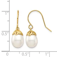 Pair of gold-toned drop earrings with white pearl teardrop pendants and decorative filigree caps, shown next to a measurement scale.