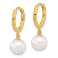A pair of gold hoop earrings with white pearl drops attached by small gold connectors.