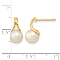 A pair of gold drop earrings with cream-colored pearl pendants, shown next to a measurement scale indicating approximately 0.75 inches in length.