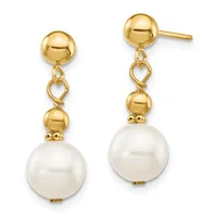Pair of gold drop earrings with polished spheres at top, heart-shaped links, smaller gold beads, and large white pearl drops.