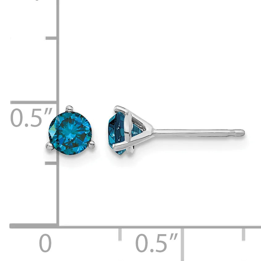 Pair of blue topaz stud earrings with three-prong settings in white metal, shown front and side view with a ruler indicating 0.5 inch diameter.