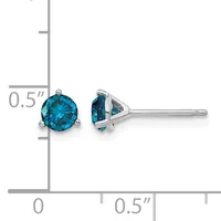 Pair of blue topaz stud earrings with three-prong settings in white metal, shown front and side view with a ruler indicating 0.5 inch diameter.