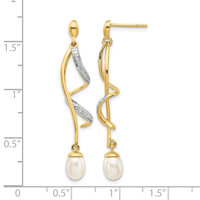 Two-tone drop earrings with twisted gold and diamond-accented upper sections suspending white pearl drops, shown on a measurement scale indicating approximately 1.5 inches in length.