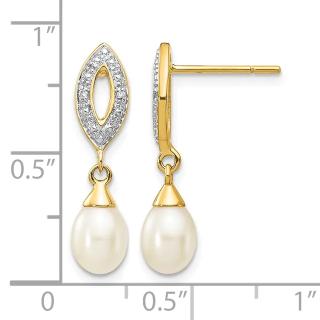 Gold drop earrings with diamond-outlined marquise tops and cream pearl teardrop bottoms, shown on a measurement scale.