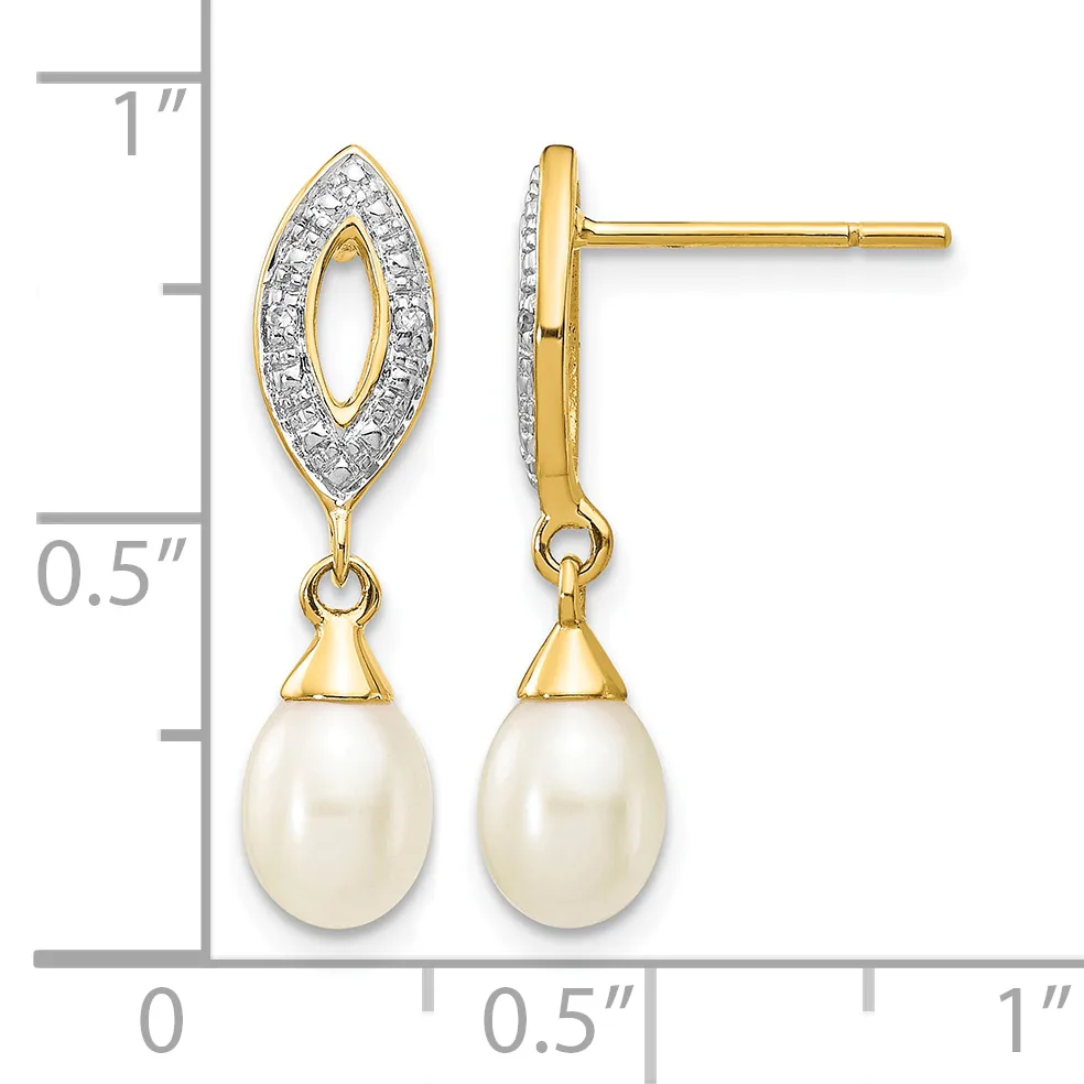 Gold drop earrings with diamond-outlined marquise tops and cream pearl teardrop bottoms, shown on a measurement scale.