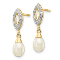A pair of gold and diamond drop earrings with marquise-shaped tops featuring diamond pavé borders and cream-colored pearl drops suspended below.