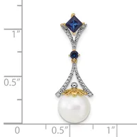 A two-tone pendant featuring a princess-cut blue sapphire at the top, a smaller round blue sapphire in the middle, and a white pearl at the bottom, connected by ornate silver and gold filigree work, displayed against a ruler showing approximately one inch in length.