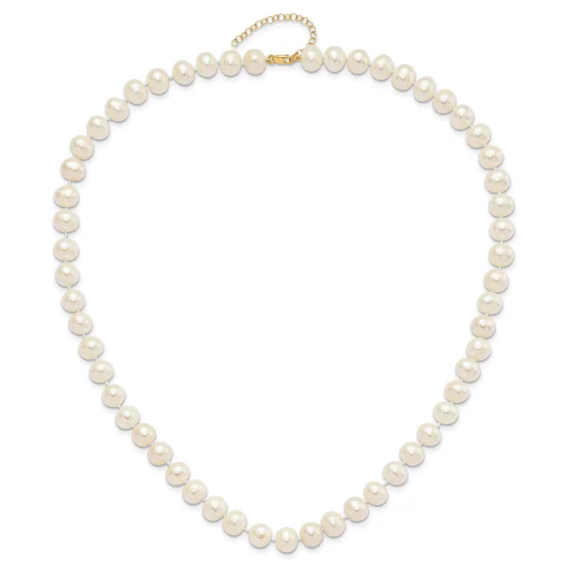 A strand of round cream-colored pearls with a gold-tone chain clasp, displayed as a closed necklace.