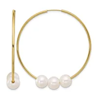 Gold-colored hinged bangle bracelet with three white pearl spheres and matching pearl drop earring with gold wire.
