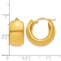 A pair of polished gold hoop earrings with a rounded rectangular shape, shown next to a measurement scale indicating approximately one inch in height and half an inch in width.