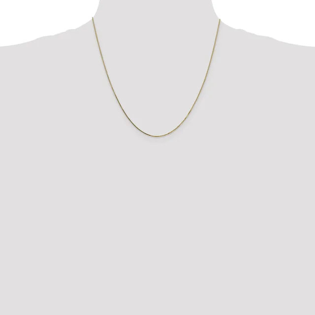 A thin gold chain necklace displayed on a mannequin bust against a white background.