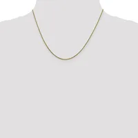 A thin gold-toned snake chain necklace displayed on a mannequin bust against a neutral background.