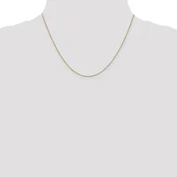 A thin gold-toned chain necklace displayed on a mannequin torso against a white background.