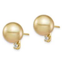 Pair of gold stud earrings featuring large golden pearl spheres with small diamond accents mounted on gold posts.