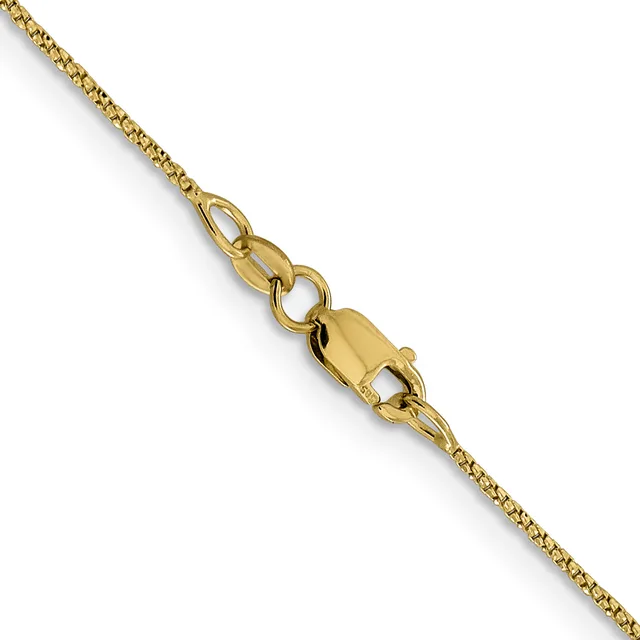 A gold chain necklace with a lobster claw clasp, displayed diagonally against a white background.