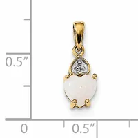 A gold pendant featuring a heart-shaped white stone topped with a diamond accent, displayed next to a ruler showing approximately 0.5 inches in height.