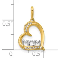 Gold heart-shaped pendant with "MOM" text in the center, decorated with cubic zirconia stones along the curved edges, shown against a measurement scale.