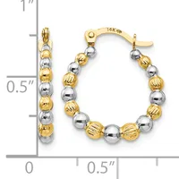 Two-tone gold and silver beaded hoop earrings with alternating textured and smooth spheres, displayed against a measurement scale showing approximately one inch in length.