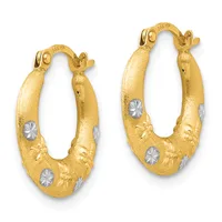 Pair of gold hoop earrings with textured surface and white diamond-cut accents, featuring hinged posts and leaf-like decorative elements.