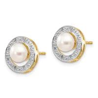 Pair of round stud earrings with cream-colored pearls surrounded by diamond halos set in two-tone gold with post and butterfly backs.