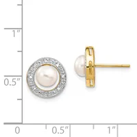 A pair of round stud earrings with white pearls surrounded by diamond halos, shown front and back view next to a measurement scale.