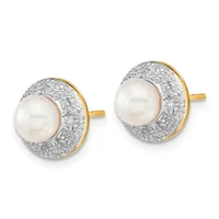 A pair of gold stud earrings featuring white pearls surrounded by pavé-set diamonds in a circular design, shown from the front against a white background.