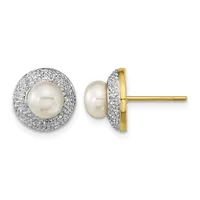 A pair of stud earrings featuring white pearls surrounded by pavé-set diamonds in a halo design, shown from front and side views with gold posts.
