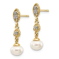 A pair of gold dangle earrings with textured oval tops set with diamonds, connected by chain links to pearl drops below.