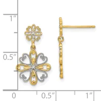 Two-tone gold drop earrings with ornate floral cross designs featuring diamond accents, shown next to a ruler for scale.