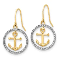 Pair of gold and silver-tone anchor earrings with circular diamond-accented frames and gold fish hook wires.