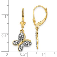 A pair of gold leverback earrings with four-petal flower charms decorated with white crystals, displayed next to a measurement scale showing approximately one inch in length.