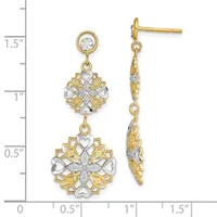 Two-tone gold and silver dangle earrings with round crystal studs, ornate floral medallions, and heart-shaped accents, displayed on a measurement scale.