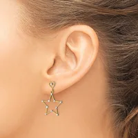 A person wearing a silver-toned star-shaped dangle earring with a small heart-shaped connector, shown on their earlobe in profile.