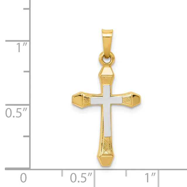 Gold cross pendant with white enamel center and textured gold ends, shown against a measurement scale indicating approximately one inch in height.