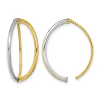Two oval bangle bracelets with two-tone design featuring polished yellow gold inner surfaces and brushed silver outer surfaces.