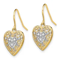 Pair of gold heart-shaped drop earrings with ornate filigree design and diamond accents, suspended from gold shepherd's hook wires.