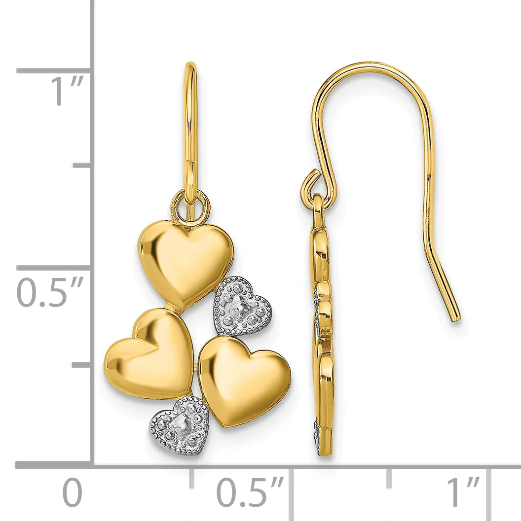 Gold heart-shaped earrings with diamond accents hanging from gold shepherd's hook ear wires, displayed against a measurement scale.