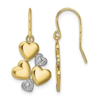 Gold heart dangle earrings with polished and textured heart charms, accented with diamond pave hearts, suspended from curved ear wires.