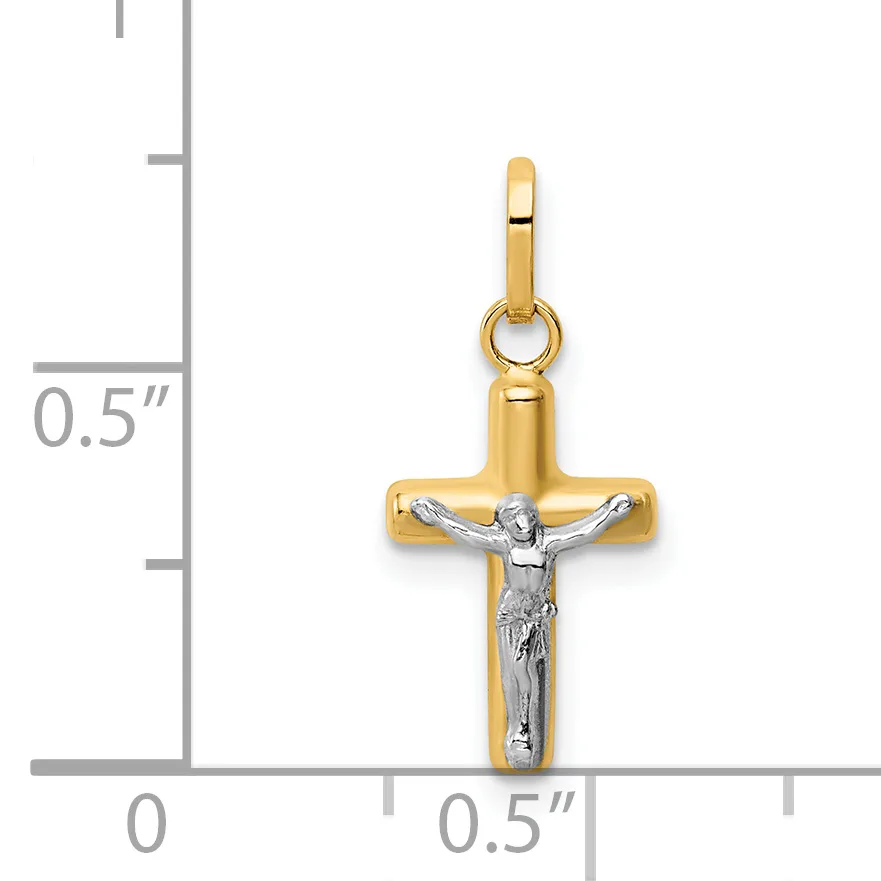 Two-tone gold cross pendant with white gold crucifix figure, displayed against a measurement scale showing approximately half inch width.