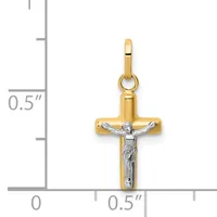 Two-tone gold cross pendant with white gold crucifix figure, displayed against a measurement scale showing approximately half inch width.