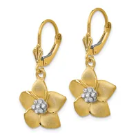 Pair of gold flower drop earrings with textured petals and white gemstone centers, suspended from lever-back hooks.