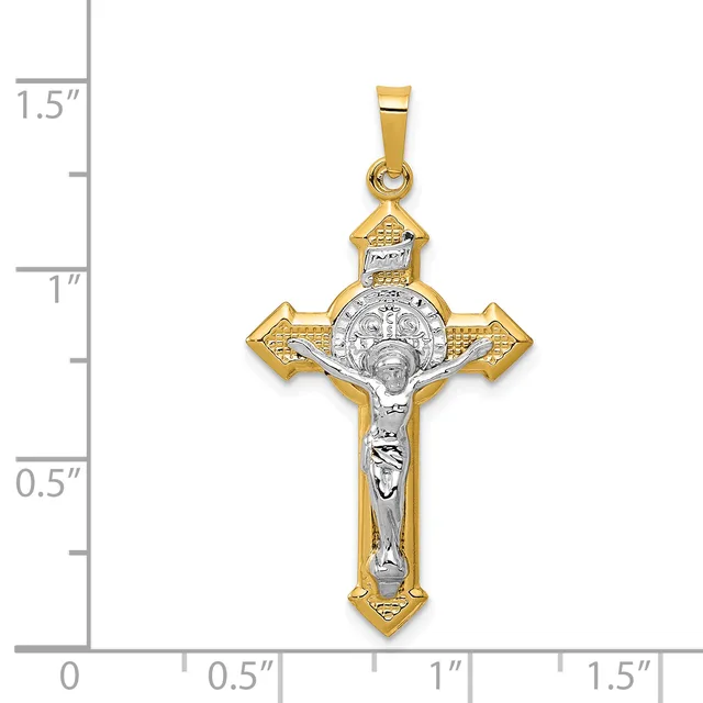 Two-tone gold and silver cross pendant with crucifix figure and ornate decorative elements, shown next to a measurement ruler indicating approximately 1.25 inches in height.