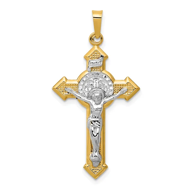 Two-tone gold and silver crucifix pendant with ornate ends and a corpus figure, suspended from a bale.