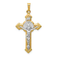 Two-tone gold and silver crucifix pendant with ornate ends and a corpus figure, suspended from a bale.