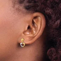 A person wearing a two-tone drop earring with a gold ball post and silver crescent-shaped pendant, shown from the side profile.