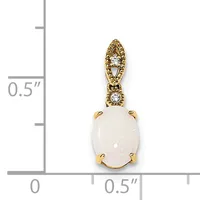 Gold pendant with oval white opal stone set in prongs, topped with ornate bail featuring two small diamonds, shown against a measurement scale.