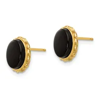 A pair of gold stud earrings with oval black onyx stones surrounded by a textured gold bezel setting.