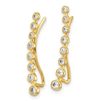A pair of gold curved ear climber earrings set with round diamonds in bezel settings along their length.