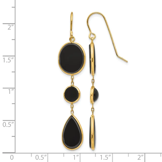Gold-toned drop earrings with black onyx stones in oval and teardrop shapes, shown on a measurement scale.